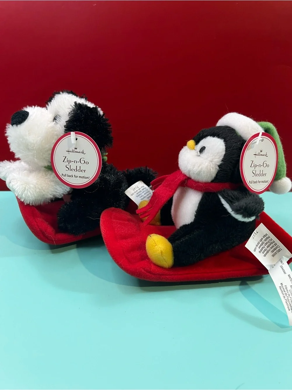 Hallmark Black & White Penguin with Red Scarf Plush Sledder